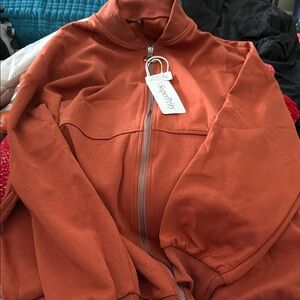 Brown (towards a rust color) Zip-Up Jacket. Size Medium. NWT.